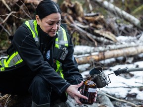 Danya Douglas, a S'ólh Téméxw guardian, assists in the collection of water samples in flood-ravaged areas of the Sumas region as part of a contaminant analysis project led by Raincoast Conservation Foundation.