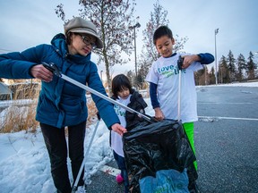 Sophia Huang often organizes her son, Louis, 10, and daughter, Irene, 5, to go out with other young children in the Surrey neighbourhood of Fraser Heights to pick up garbage. Wearing "Love where you live" shirts, they frequently turn it into a game. Last year volunteers and others collected 4,681 garbage bags of Surrey litter.