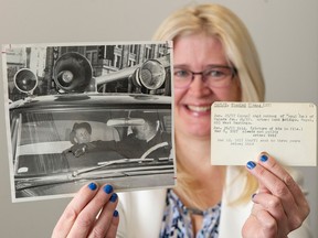 Sun and Province librarian Carolyn Soltau holds a picture of 1957 bank robber Stanley Thomas Taylor and his Vancouver Sun criminal card, at the paper’s offices in Vancouver on Tuesday, Dec. 6, 2022.