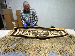 Taku River Tlingit First Nation elder Wayne Carlick with the Chilkat blanket that was bought at auction, in Vancouver on Dec. 8.