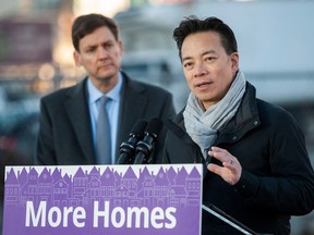 Premier David Eby, left, and Vancouver Mayor Ken Sim announce modular housing for homeless people.
