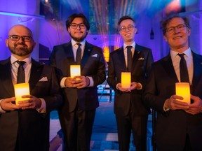 Members of Chor Leoni men's choir prepare to perform seasonal tunes at St. Andrew's Wesley Church in Vancouver this December. Left to right, Jaime Vargas, Alex Vollant, Alan Chiang, Chris Moore.