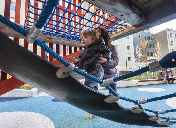  leo fumano, 2, gets a helping hand from layla humayun, 10, while playing at sθәqәlxenәm ts’exwts’áxwi7, also known as rainbow park, in vancouver on wednesday.