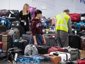 Hundreds of unclaimed pieces of luggage that need to be reunited with their owners sit at YVR on Thursday.