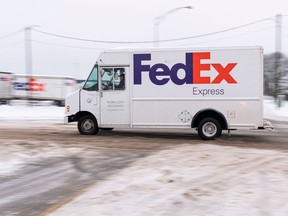 Professional drivers are in high demand in BC A FedEx delivery truck drives down a road in Richmond on Friday. Photo: Richard Lamb