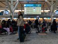 Travellers are pictured inside YVR.