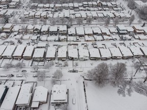 Aerial view of snow-covered houses in Vancouver on Sunday, Dec. 18, 2022.