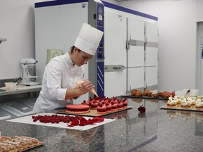 Alexandra Launay, Ladurée Canada's executive pastry chef, works on specialty cakes at company's Burnaby pastry laboratory.