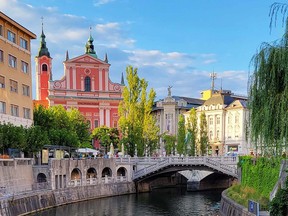 The popular three bridges area in Ljubljana’s centre, backdropped by the pink hued Franciscan Church of the Annunciation.