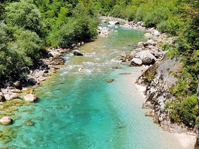 Mineral fragments give the Soča River its aquamarine look, along with crystal-clear water makes it seem like a tropical beach.