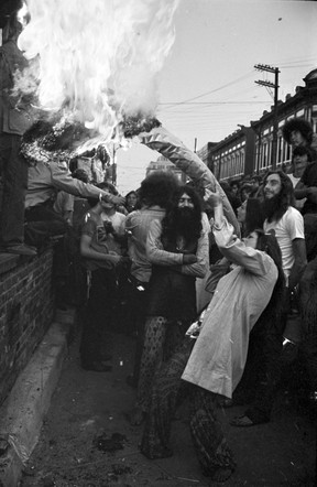 A protester smokes a fake 10-foot joint at the Grasstown Smoke-In and Street Jamboree in Gastown on August 7, 1971. It was dubbed the Gastown Riot after police attacked the protesters.