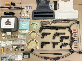 A loaded shotgun, methamphetime, fentanyl, cocaine and $7,000 cash were seized during a raid on a home on Grosvenor Road in Whalley on Wednesday, Jan. 11, 2023, say Surrey RCMP.