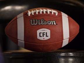 A football with the new CFL logo sits on a chair in Winnipeg on November 27, 2015.