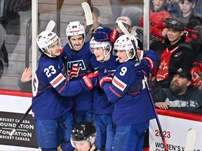 Chaz Lucius (16) of Team United States celebrates his goal with teammates Jack Peart (23), Sam Lipkin (22) and Jackson Blake (9) during the second period against Team Sweden in the bronze medal round of the 2023 IIHF World Junior Championship at Scotiabank Centre on Jan. 5, 2023 in Halifax, N.S.