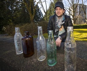 Christian Laub and his cool collection of old bottles he dug out of the ground.