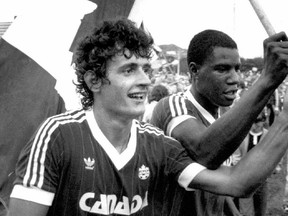Paul James, left, and Canadian national soccer team teammate Randy Samuel celebrate a 2-1 win over Honduras in 1985.