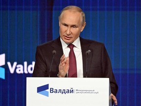 Russian President Vladimir Putin speaks at a Valdai Discussion Club forum on Oct. 27, 2022.