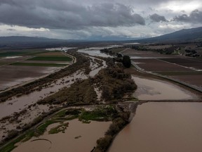 The Salinas River overflows its banks, inundating farms near the central coast last month as atmospheric river storms caused widespread destruction across the state, which is the source of a lot of B.C. produce, especially in the winter and spring.