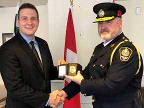 Constable Mathieu Nolet, left,  with Chief Donovan Fisher of the Nelson Police Department. Nolet suffered severe internal injuries and died Saturday morning in Kelowna’s hospital, Chief Donovan Fisher said in a video statement.