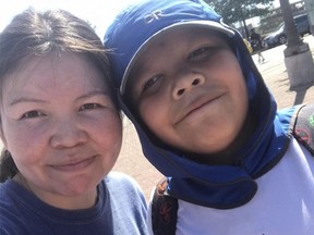 Mia Brown and her son Anthony, 12, pose in this undated photo.  The mother of a 12-year-old indigenous boy who was handcuffed by police at BC Children's Hospital in Vancouver says it should have been a safe place for her son, who has autism, but was tied to the ground and treated like an adult .  .