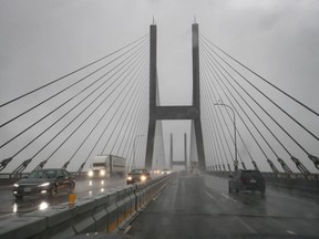 The Alex Fraser Bridge is seen in Delta, B.C., on Thursday Dec.12, 2019. Police say drivers on the bridge honked and yelled at a man in a mental health crisis standing outside the safety rail, even encouraging him to "take action."