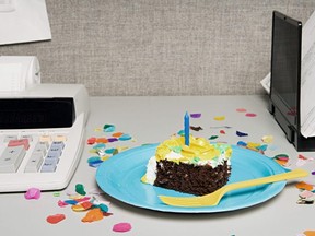 Birthday cake on an office desk.