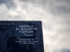 A photograph shows a sign of the World Economic Forum (WEF) in the alpine resort of Davos, on the opening day of the annual meeting in Davos on January 16, 2023. - The world's political and business elites gather for the annual Davos summit to promote "cooperation in a fragmented world", with war in Ukraine, the climate crisis and global trade tensions high on the agenda.