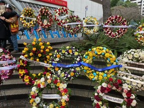 Wreaths for construction workers who died while building the Bentall IV tower on Jan. 7, 1981, are seen at a memorial there on Friday, Jan. 6, 2023, 42 years later.