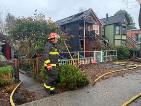 Firefighters at the site of an early morning fire in the 700-block Keefer Street in Vancouver's Strathcona neighbourhood.