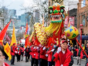 People attend the annual Chinatown Spring Festival parade, amid the Lunar New Year celebrations in Vancouver on Sunday.