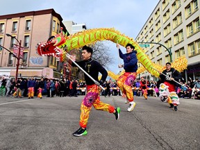 People attend the annual Chinatown Spring Festival parade, amid the Lunar New Year celebrations in Vancouver on Sunday.