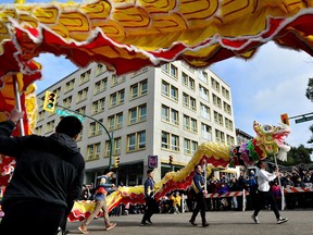 People attend the annual Chinatown Spring Festival Parade, amid Lunar New Year celebrations in Vancouver on Sunday.