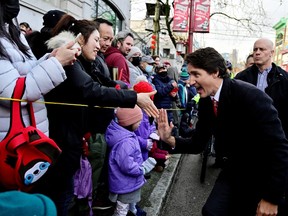 Prime Minister Justin Trudeau greets people at the Chinatown Spring Festival Parade, amid Lunar New Year celebrations, in Vancouver on Sunday.