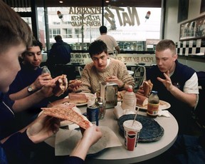 Actor Josh Jackson, (centre) eats pizza with ex-schoolmates and friends at Nat’s New York Pizzeria on Broadway in Kits in 1998. Josh frequented Nat’s when he attended Kits Secondary.