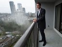 Prime Minister David Eby on the balcony of a suite at the 115 Place Housing Co-operative in Burnaby, following the announcement of rental housing protections, on Thursday, January 12, 2023.