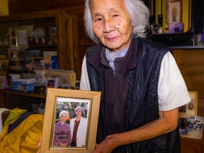 Kyoko Mineshiba with the photo of her mother, Shige.