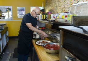 Leo Sarantopoulos prepares a pizza at his Vancouver pizzeria, Zaccary’s Pizza.