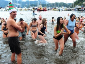 Scenes from the Deep Cove Penguin Plunge at Panorama Park in Deep Cove, BC., on January 1, 2023.