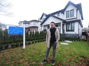 Adil Dinani, realtor with the Dinani Group, Royal LePage West Realty, at a house at 2646 Venables St. in Vancouver as Canada's temporary ban on foreign real estate purchases takes effect.