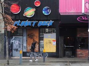 A pedestrian walks down Granville Street on Tuesday.