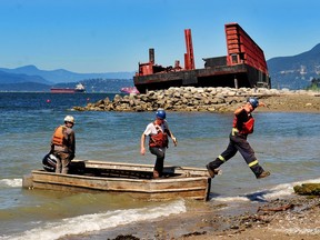 Scenes from English Bay as the stranded barge is dismantled in order to remove it following a wind storm in 2021, in Vancouver, BC., on August 8, 2022.