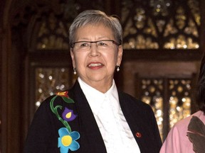 Senator Lillian Dyck stands outside the Senate Foyer on Parliament Hill in Ottawa on Wednesday, Dec. 13, 2017. Dyck, who's now retired, says she was "stunned" when she saw questions about the Indigenous heritage of former judge Mary Ellen Turpel-Lafond, whose career she had celebrated as barrier-breaking.