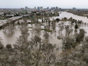 View of flooding from the rainstorm-swollen Sacramento and American Rivers, near downtown Sacramento, California, U.S. January 11, 2023.  REUTERS/Fred Greaves
