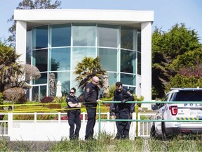 Police search the grounds of a home in Oak Bay where a man broke in and attacked a woman with a machete in April 2017. DARREN STONE, TIMES COLONIST