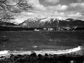 Harry Filion photo of Vancouver's West End from across English Bay, Feb. 14, 1956 . The original caption read "Sparkling sunshine and clear skies offered this unusual view of the West End of Vancouver and mountains beyond." Taken from the beach at the tip of Kitsilano, just west of Burrard bridge, picture looks across wind-whipped English Bay to West End apartments and Stanley Park.