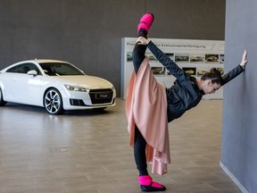 A dancer from the Gyor Ballet Company warms up at the hallway before the open rehearsal and performance entitled One Way to Heaven and Piano Plays for Audi Hungaria employees on February 9, 2023 in Gyor, Hungary. To cut down on utility costs, Hungary's famous Gyor Ballet ensemble has moved its rehearsals to the premises of one of their sponsors: an Audi car factory.