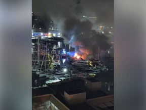 A fire suspected to be arson destroyed three boats in the marina at Granville Island early Sunday, Feb. 12, 2023.