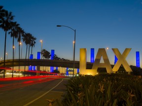 Los Angeles International Airport sign at night.