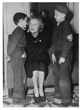 John McGinnis (left) first appeared in a Vancouver newspaper on Oct. 17, 1940, when he was chosen from a local charity to meet British movie star Madeleine Carroll. This was in The Sun. The boy on the right is Bobby Lindsay.