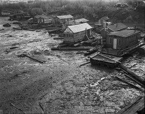 Squatters’ shacks in False Creek, 1949. John McGinnis took this photo for a story on murderer Frederick Ducharme, who lived in one of the shacks. The location was on the south side of False Creek, near the Burrard Bridge and the old Kitsilano Trestle.